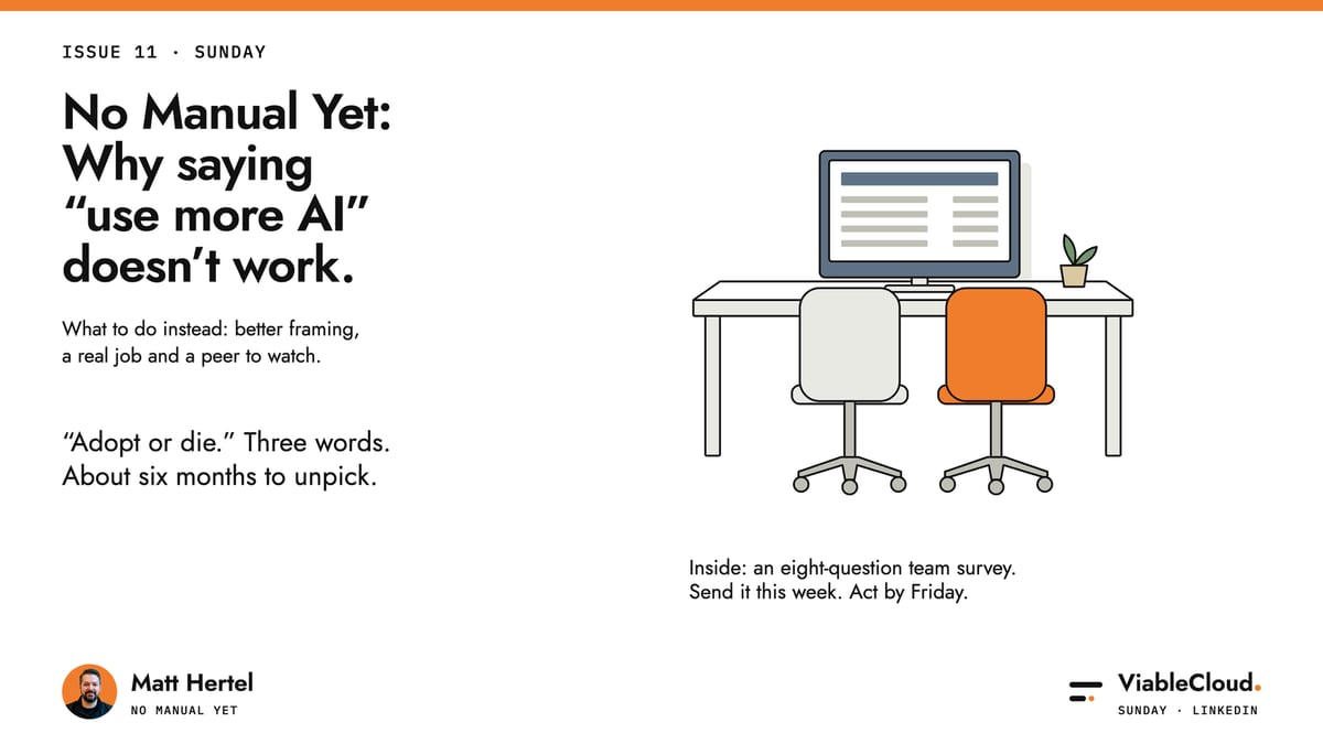 Two office chairs pulled up to one desk with a report on the monitor: a real job, done together. No Manual Yet, Issue 11.